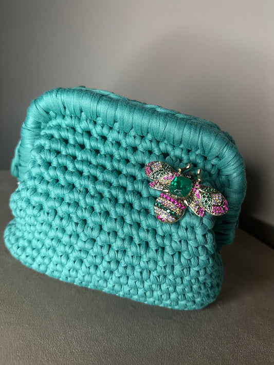 Clutch verde smeraldo spilla