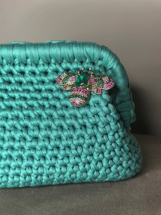 Clutch verde smeraldo spilla