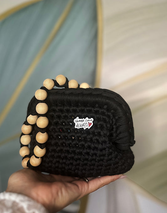 Clutch nera con tracollina